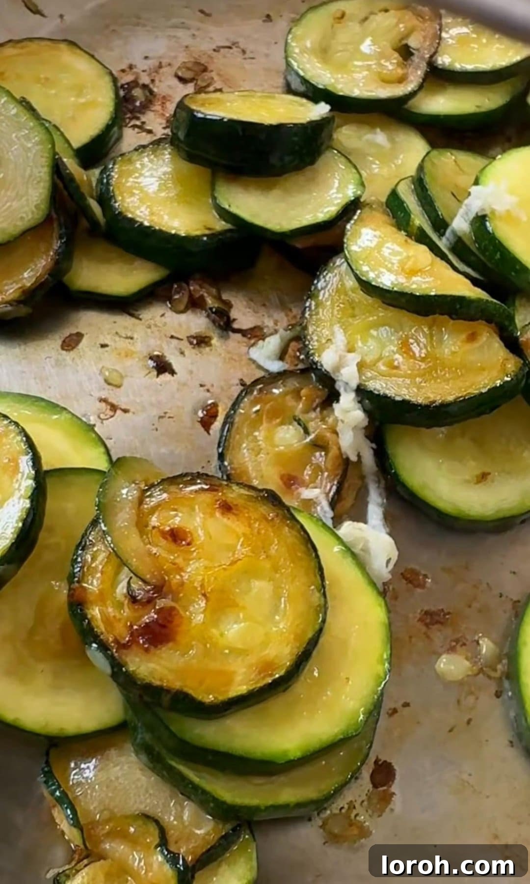 Sautéing finely sliced courgettes in a frying pan until softened and lightly golden.