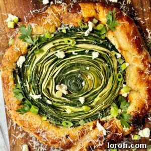 Golden Zucchini Feta Galette 10 Golden-baked Galette de Courgettes, a rustic French-inspired savory tart with zucchini, ricotta, and red pesto.