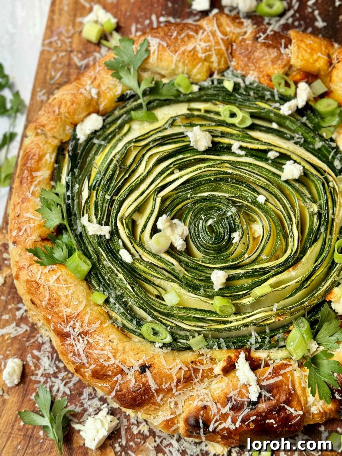 Golden Zucchini Feta Galette 3 A second view of the baked Galette de Courgettes, highlighting its golden crust and delicate courgette spirals.
