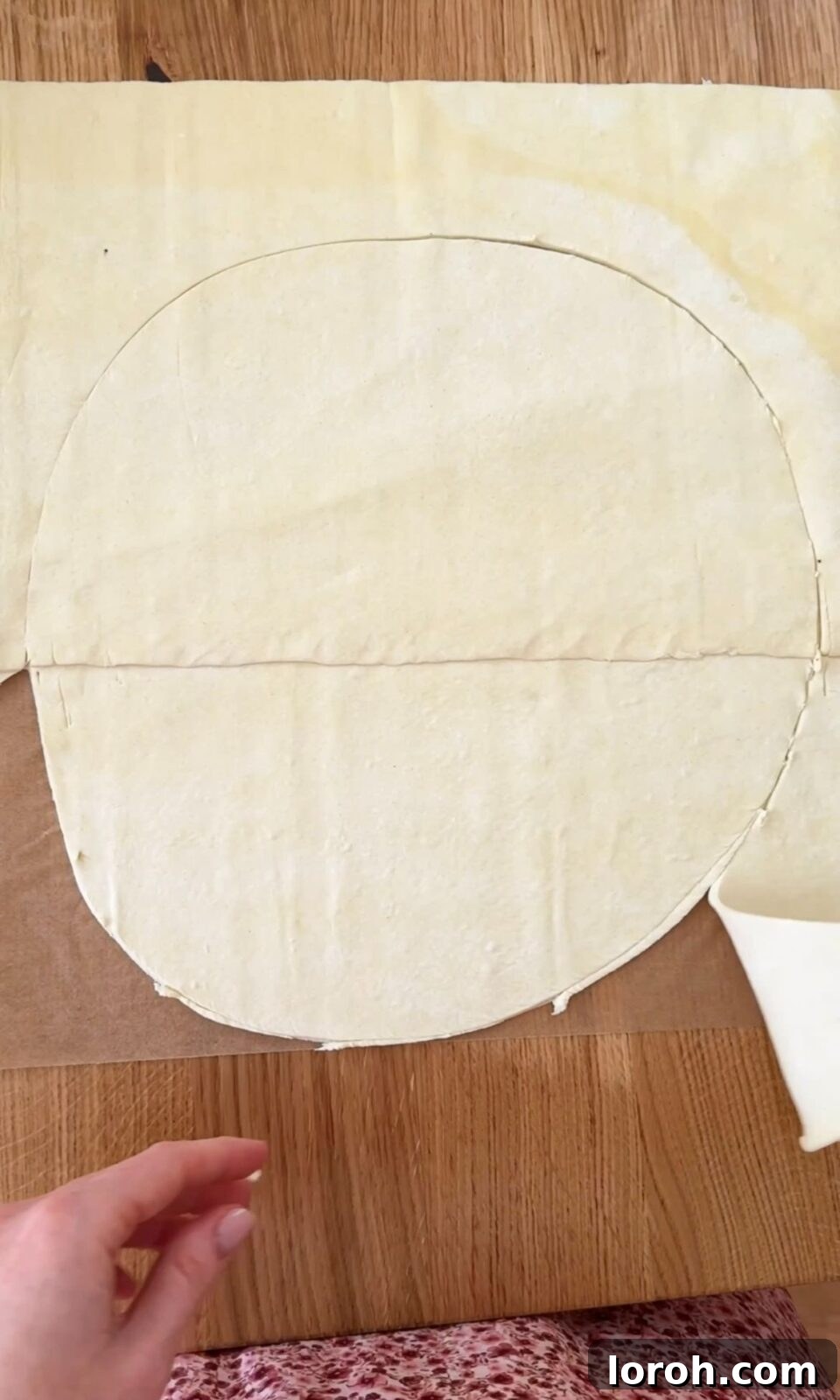 Golden Zucchini Feta Galette 4 Two sheets of puff pastry being overlapped and pressed together to form a larger base for the galette.