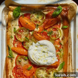 tomato puff pastry tart with burrata on top.