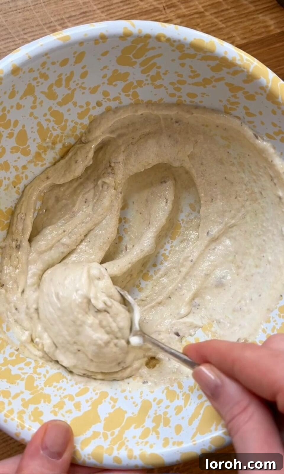 Close-up showing the smooth, creamy texture of the anchovy crème fraîche mixture.