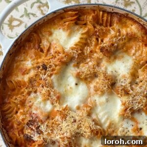 Bolognese pasta bake with spoon,