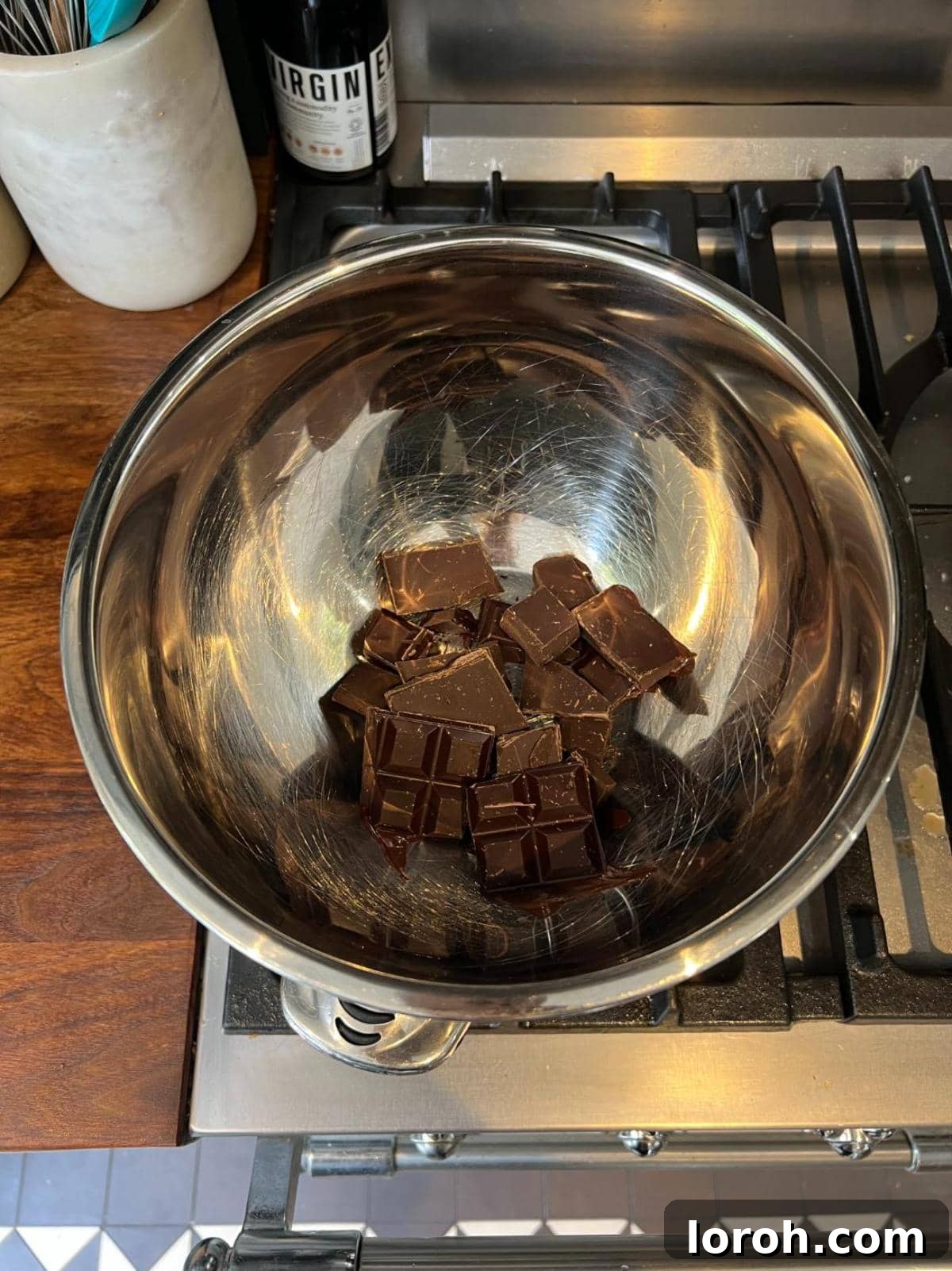 Melting dark chocolate in a bowl over a Bain Marie.