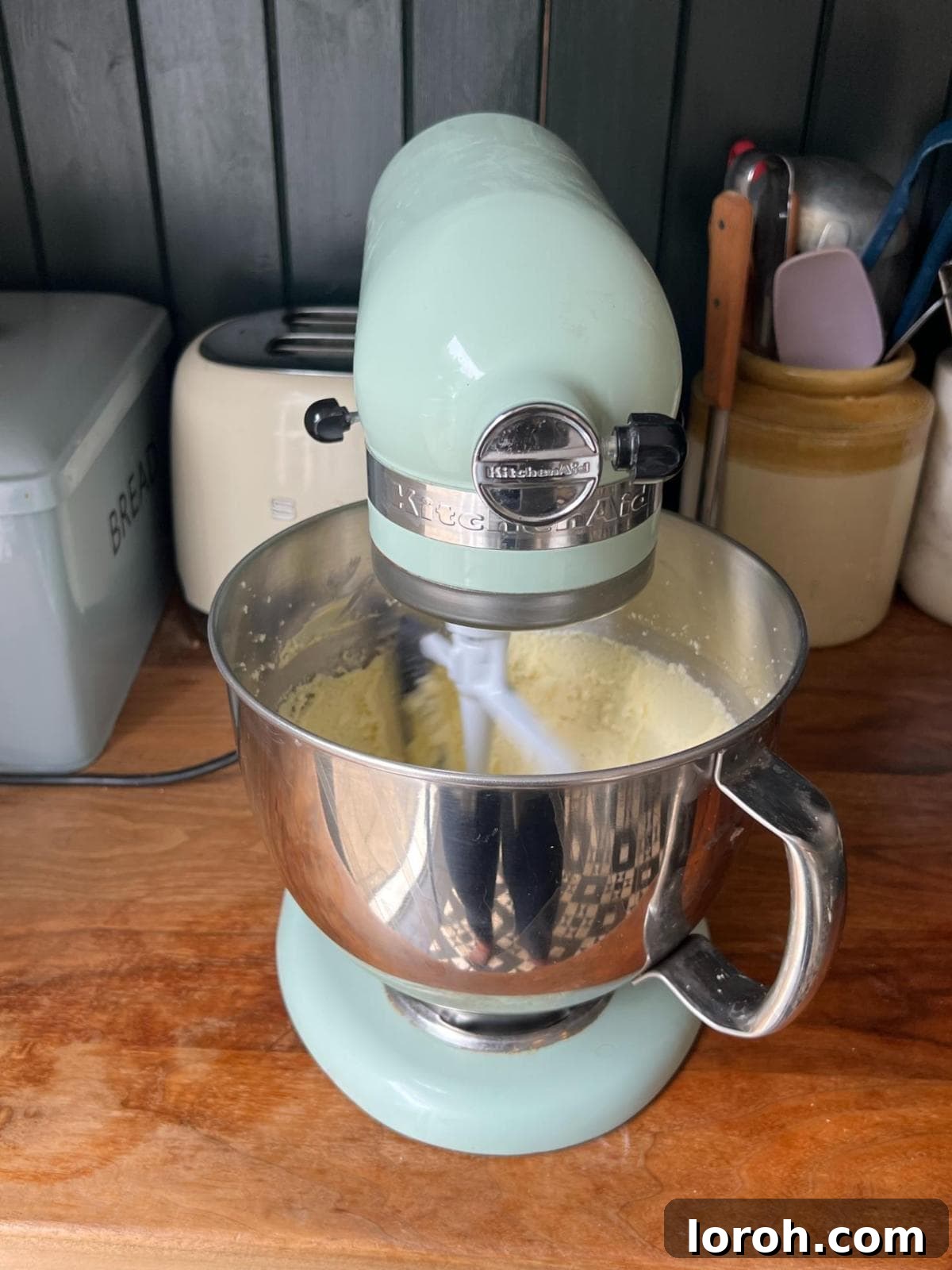 Mixing softened butter and caster sugar in a stand mixer until pale and fluffy.