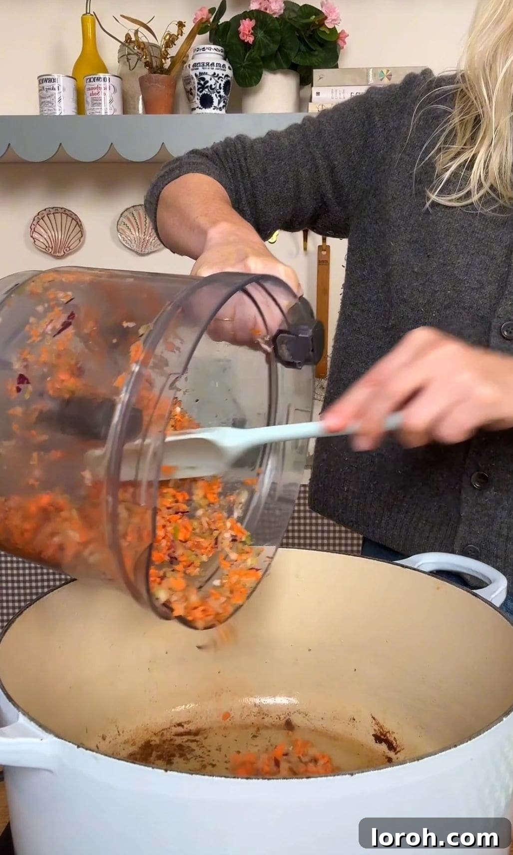 Adding diced carrots, celery, and onion (soffritto) to the pan after searing beef.
