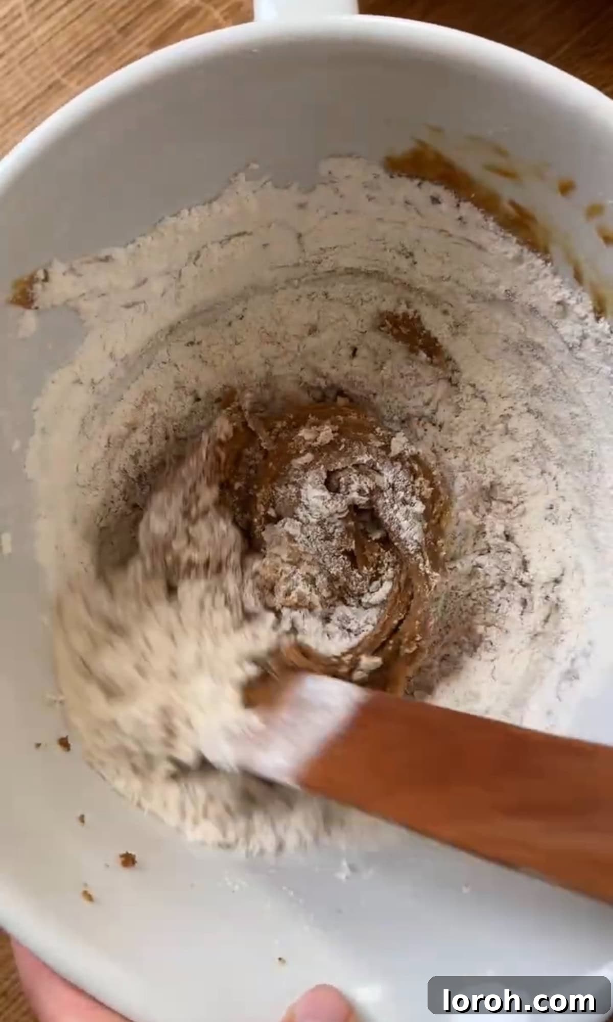 Silky Soft Chocolate Rounds 7 Mixing flour, baking soda, and salt into the cookie dough.