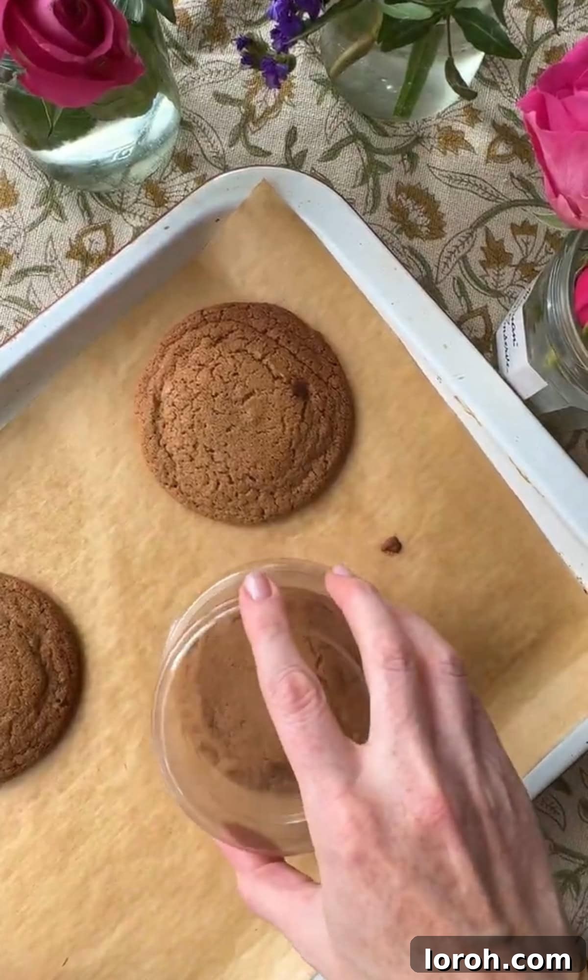 Silky Soft Chocolate Rounds 9 Reshaping freshly baked cookies with a large cookie cutter or glass for perfectly round edges.