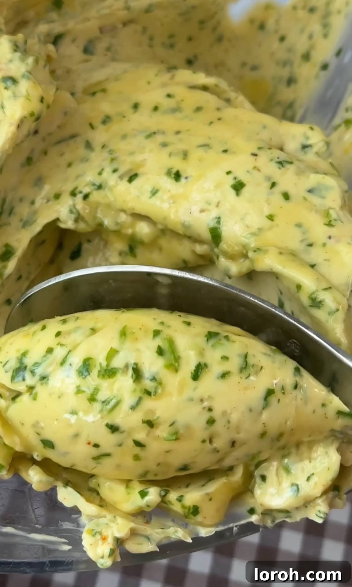 Fast Cowboy Butter Fix 10 A skilled hand scooping quenelles (oval shapes) of the freshly made cowboy butter onto a serving plate, demonstrating its soft, pliable texture.