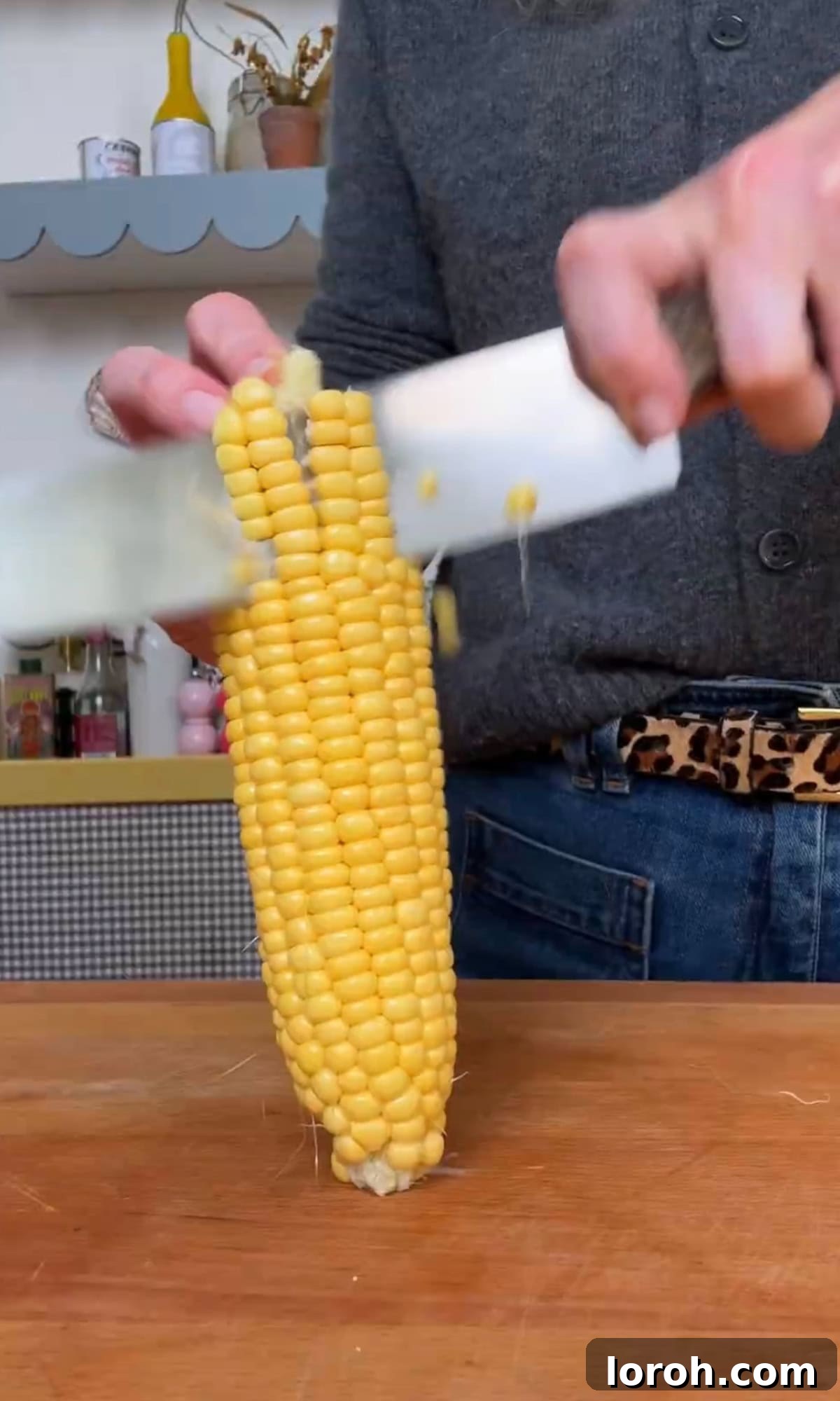 Vibrant Pastina Salad with Smoky Corn and Tangy Feta 4 shaving corn off the cob using a sharp knife.