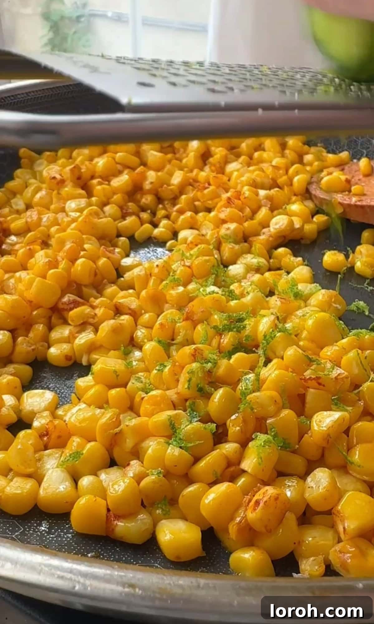 Vibrant Pastina Salad with Smoky Corn and Tangy Feta 5 frying corn kernels in a pan with lime zest and butter until charred.