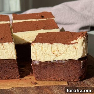 One cheesecake brownie sliced, showcasing distinct layers.
