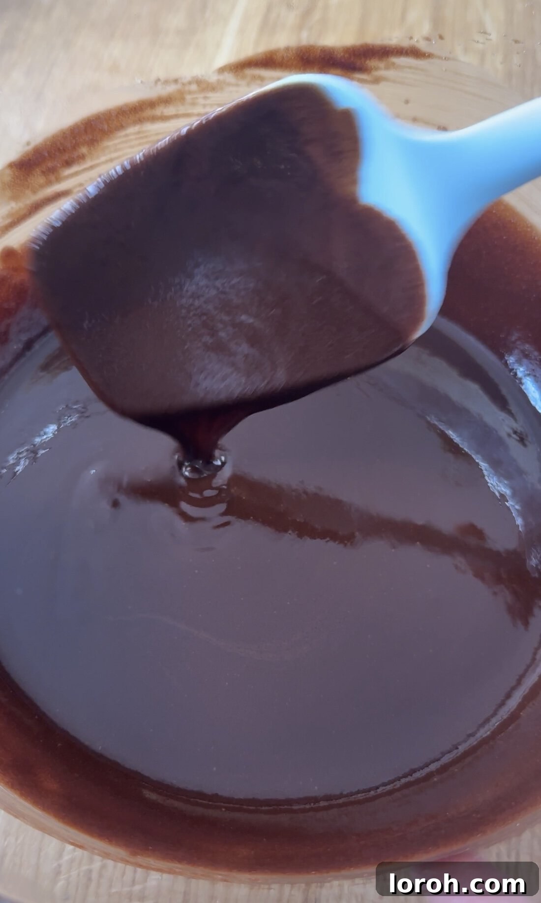 Decadent Cheesecake Brownies 4 Melting butter and chocolate in a bowl.