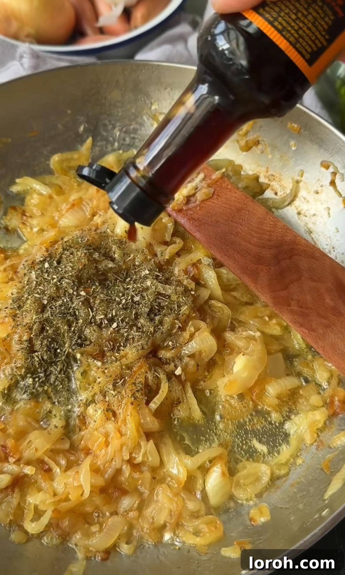 caramelising onions. Deeply golden and soft caramelized onions in a pan.