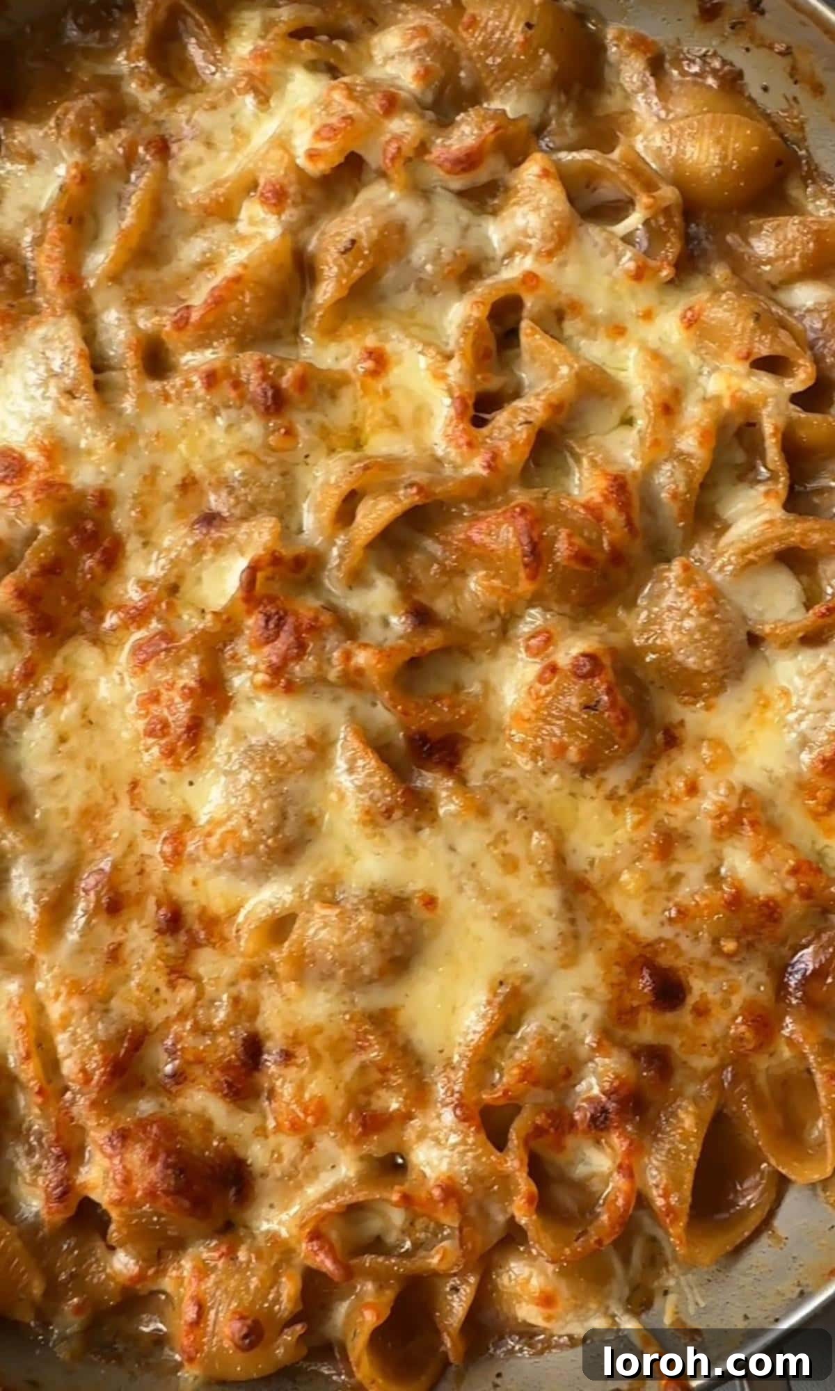 french onion soup pasta with crispy top. The finished pasta dish with a golden, bubbly cheese crust.