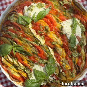 Herby Courgette and Tomato Gratin (Zucchini Al Forno) with fresh basil.