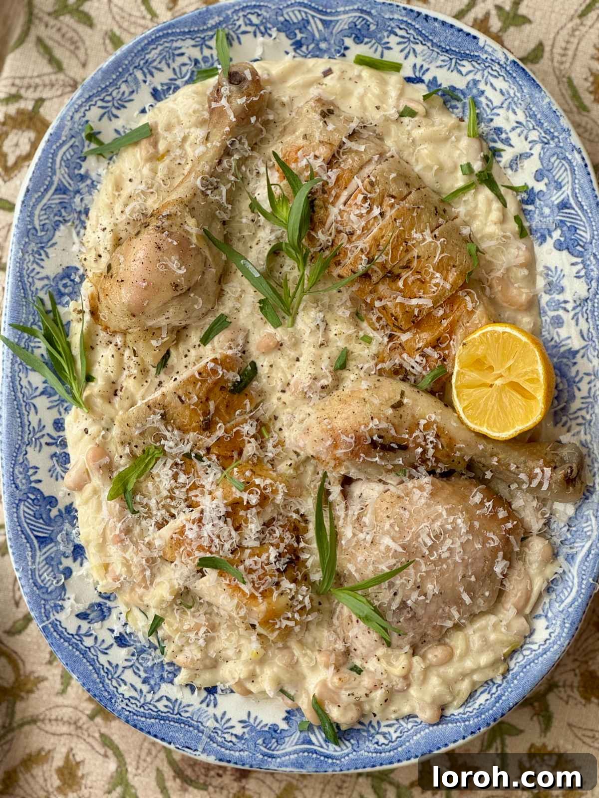 French Rustic Chicken Pot Roast 2 Poule au Pot served beautifully on a plate with creamy beans underneath.