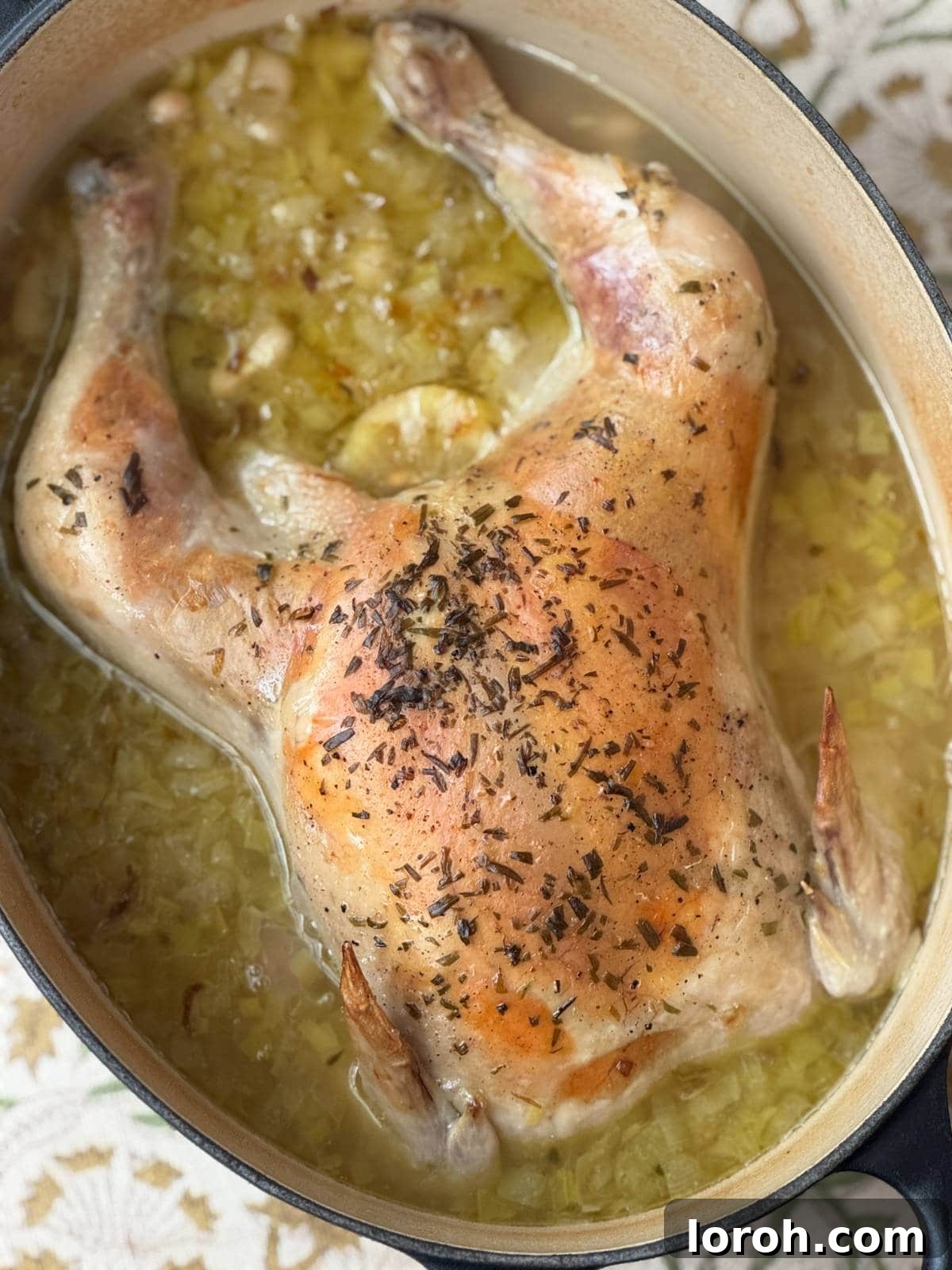 French Rustic Chicken Pot Roast 3 A whole chicken simmering perfectly in a pot, creating the essence of Poule au Pot.