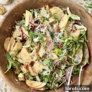 fennel apple salad in a wooden bowl.