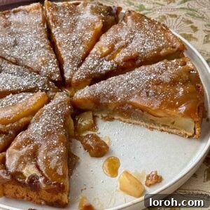 A delectable upside-down pear cake on a plate, ready to be served and enjoyed.