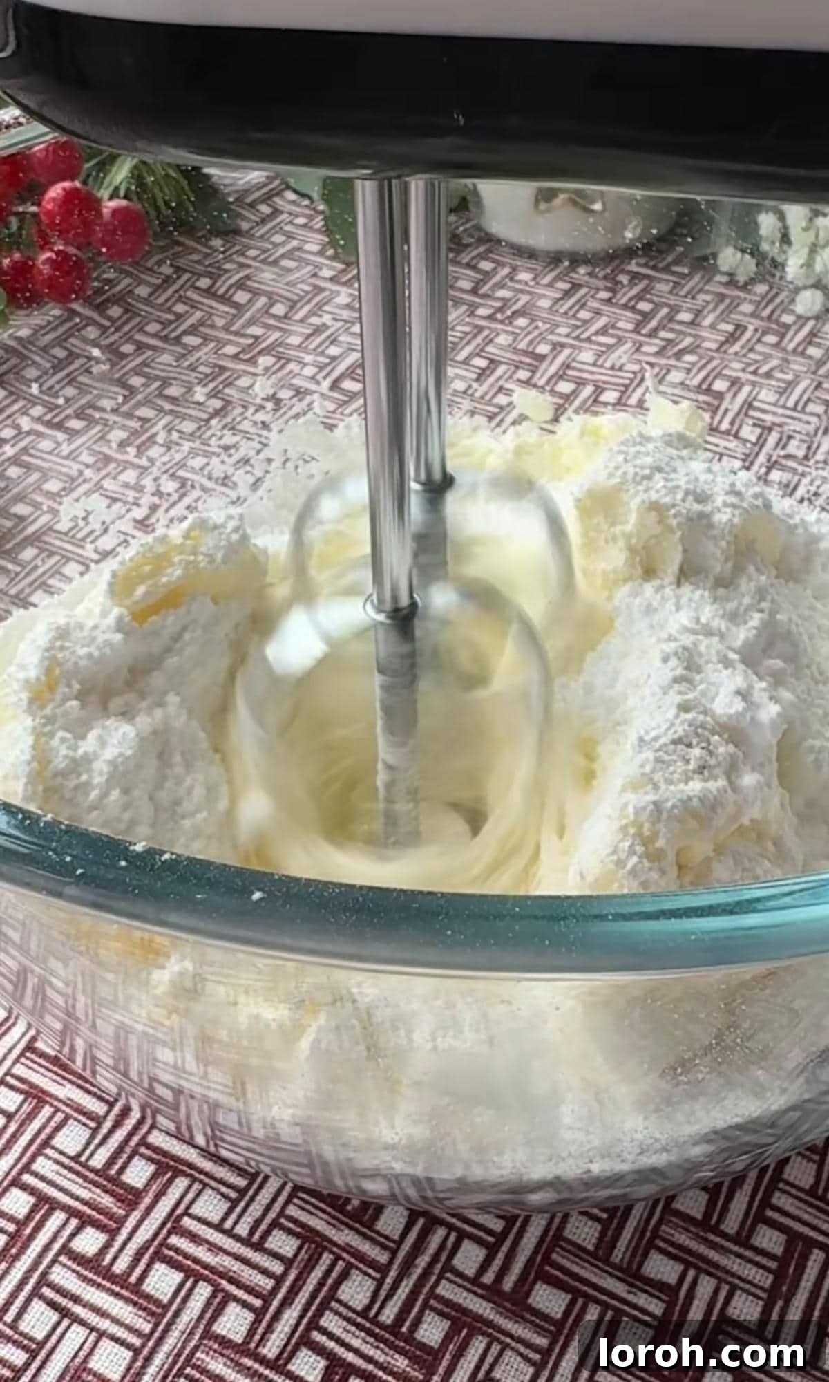 Effortless Christmas Cheesecake Bites 6 mixing cream cheese and icing sugar.