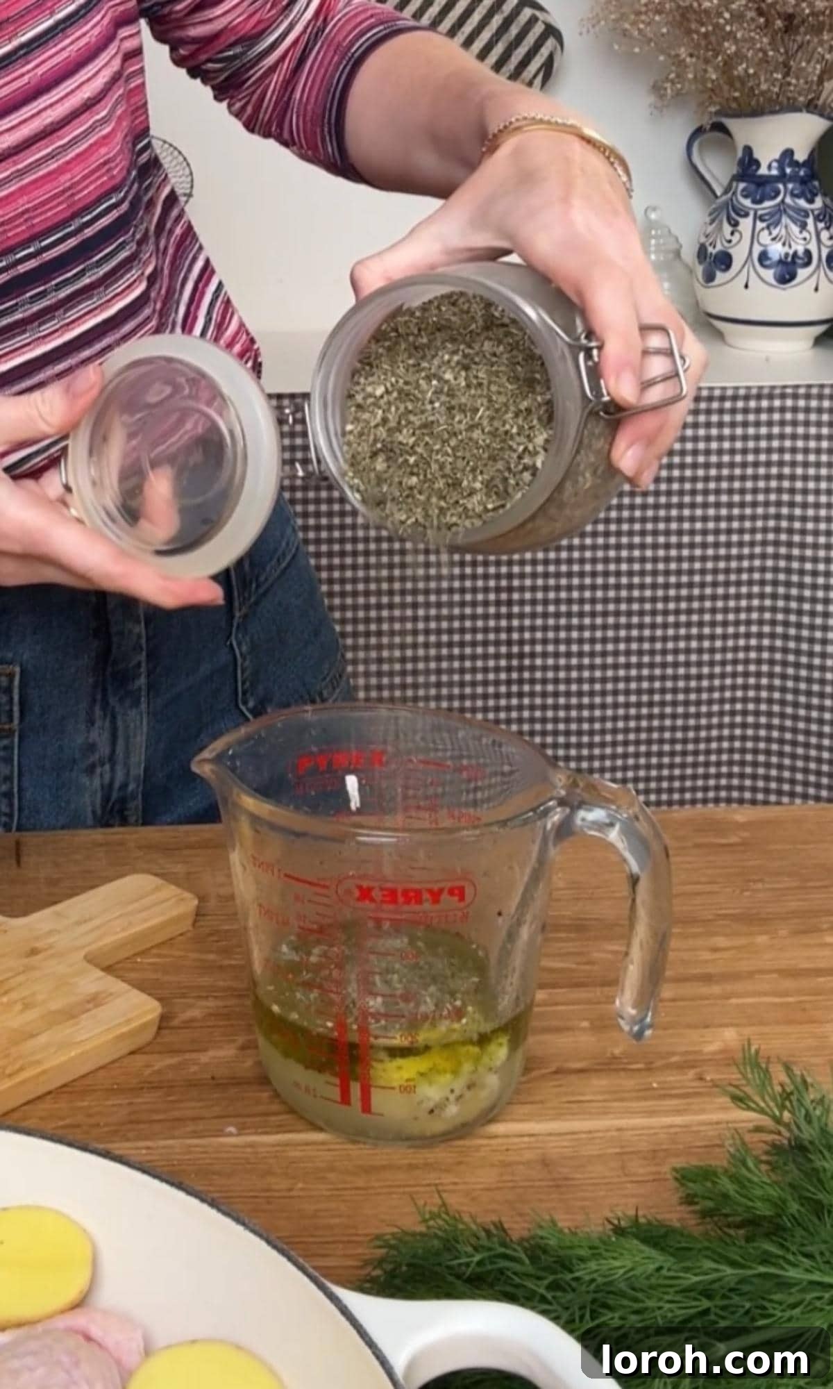 Mixing the vibrant lemon-garlic sauce in a glass jug.