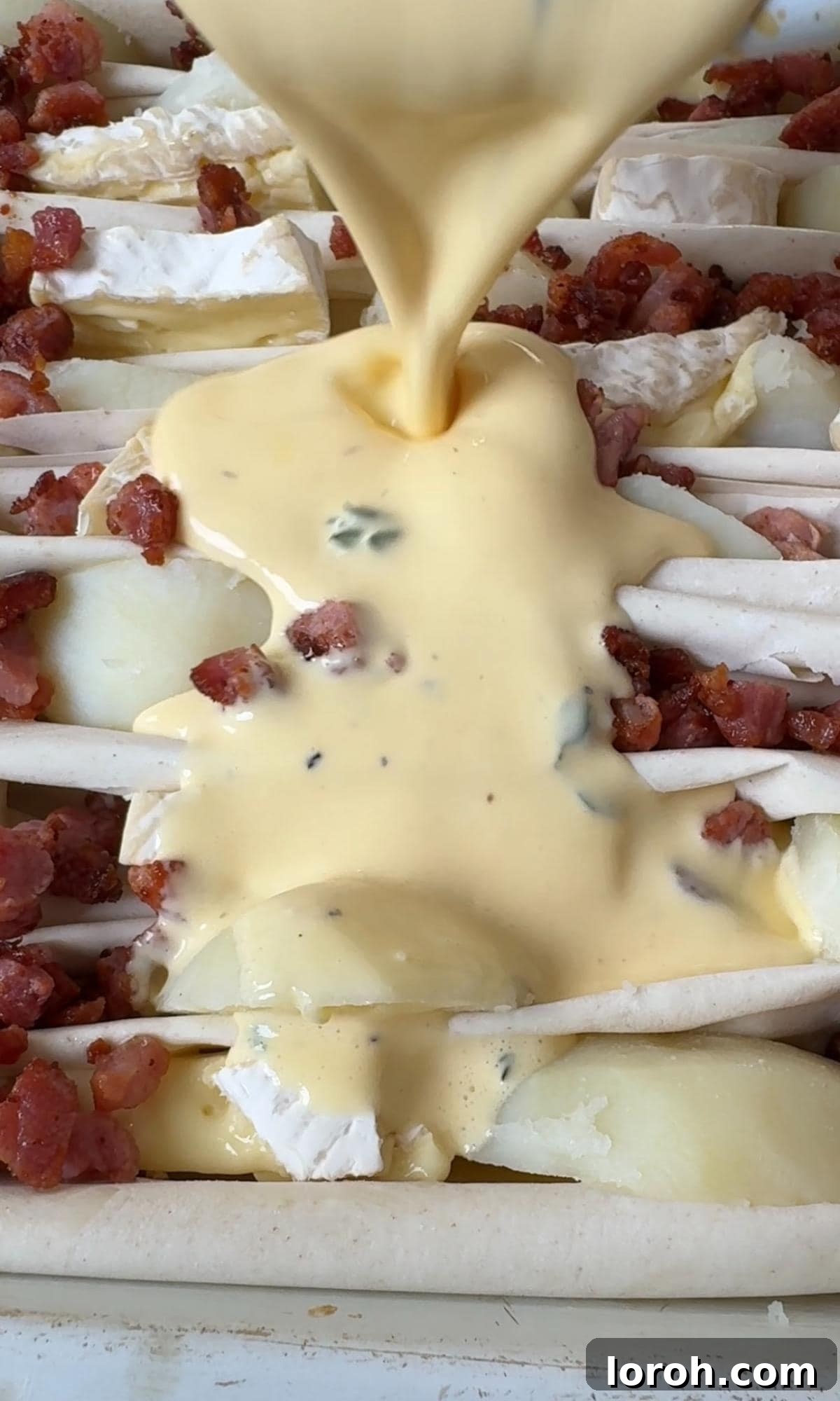 Golden Filo-Wrapped Potato Tart with Melted Brie and Crispy Pancetta 7 Step four: Pouring the whisked egg and double cream mixture over the filo tart ingredients.
