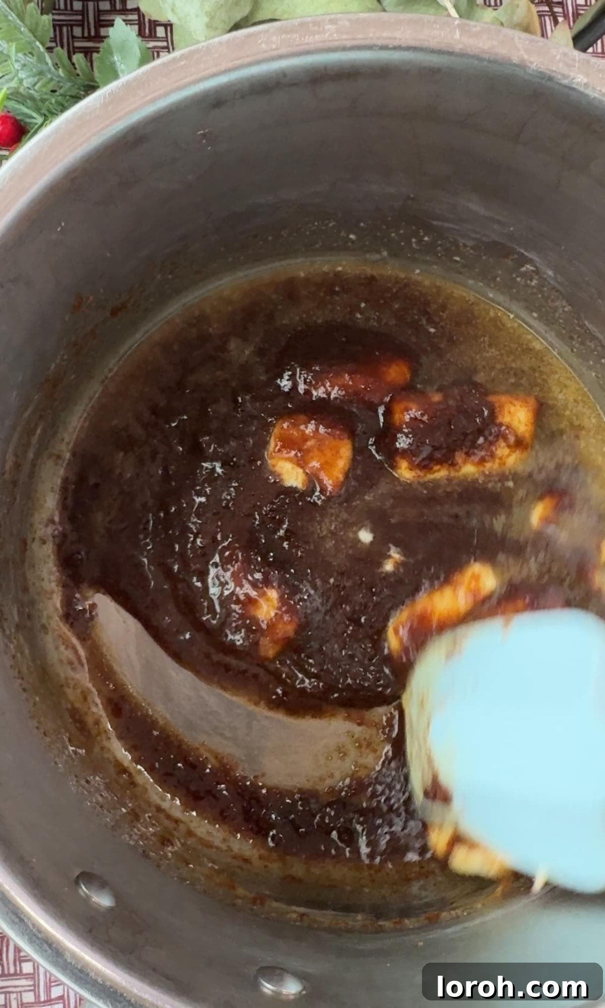 Yuletide Pretzel Crack 5 Melting butter and brown sugar together in a saucepan to create the toffee base.
