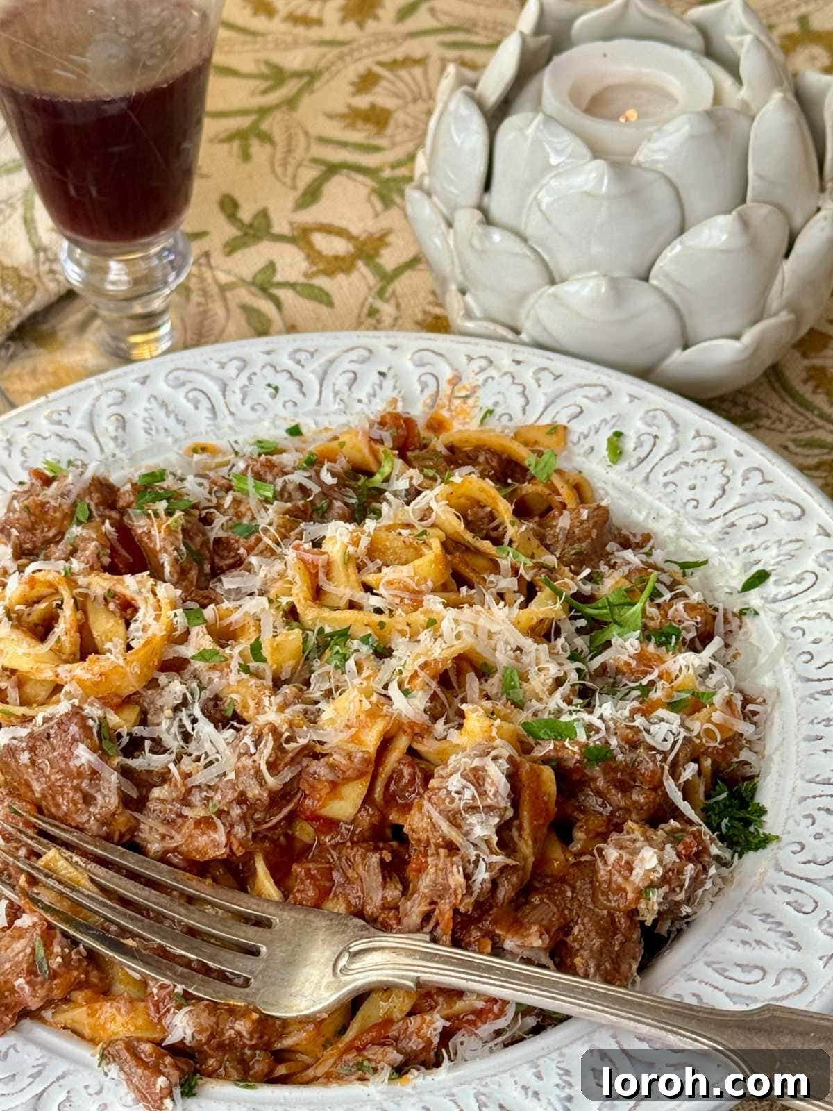 Meltingly Tender Beef Shin Ragu 3 beef shin ragu with tagliatelle in a white bowl.
