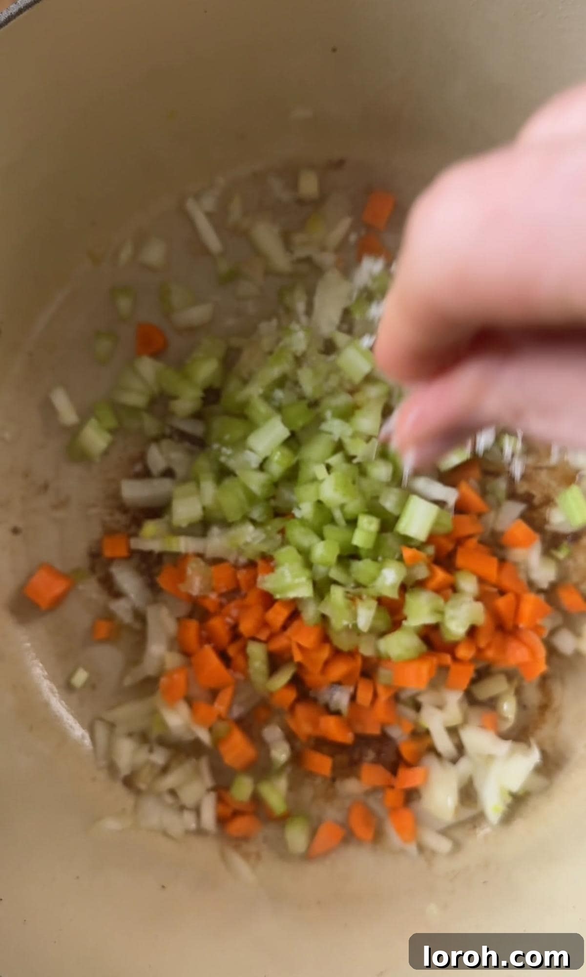 Meltingly Tender Beef Shin Ragu 5 frying diced soffritto in a pan.