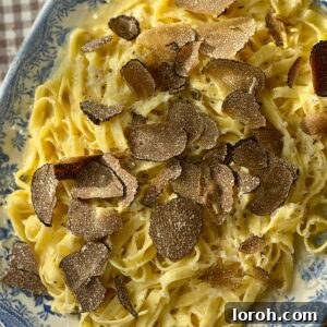 Silky Truffle Pasta Delight 7 truffles with pasta on a plate.