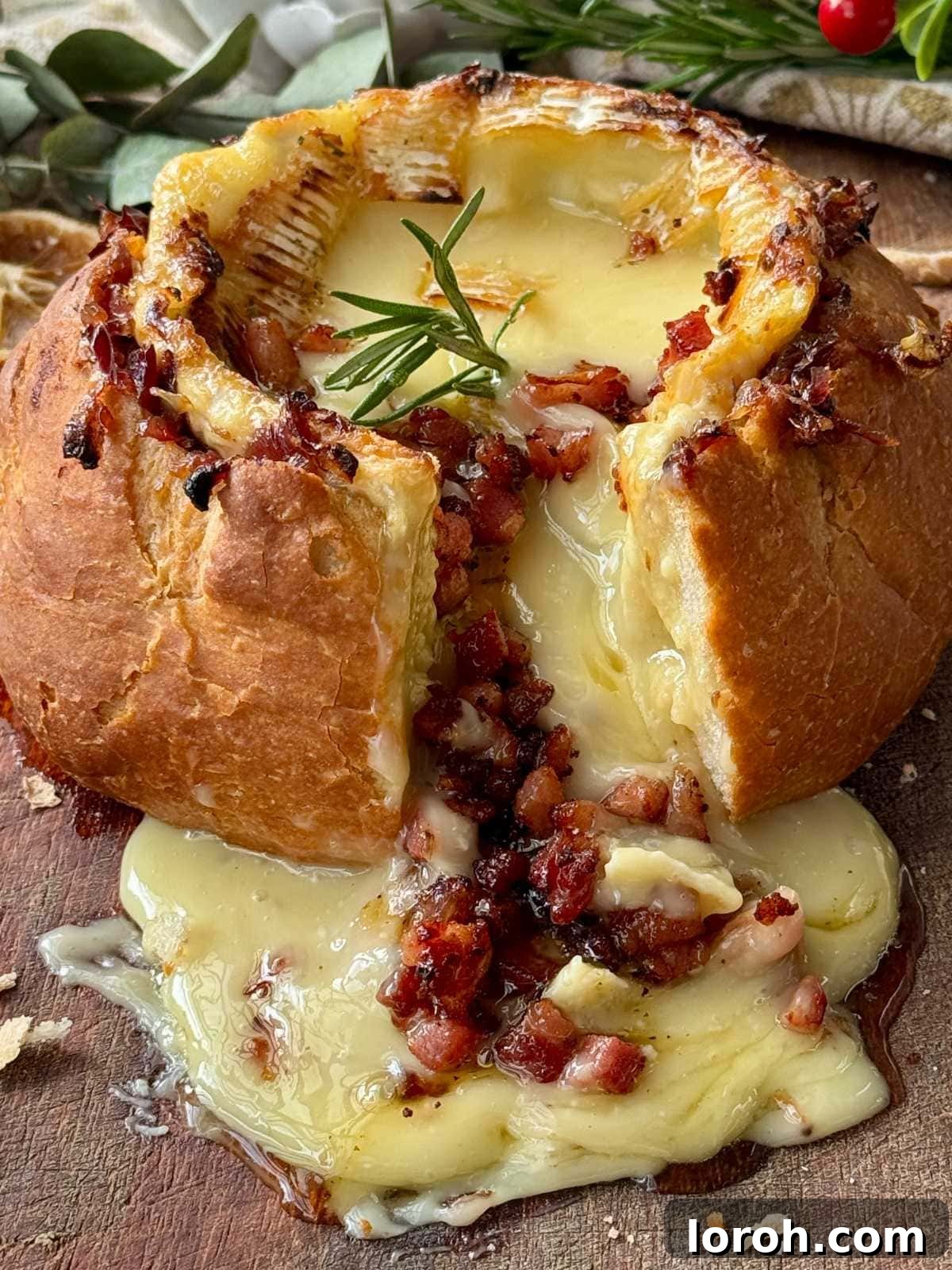 Golden Baked Camembert 2 Gooey baked camembert roti in a rustic cob loaf, served with bread for dipping.
