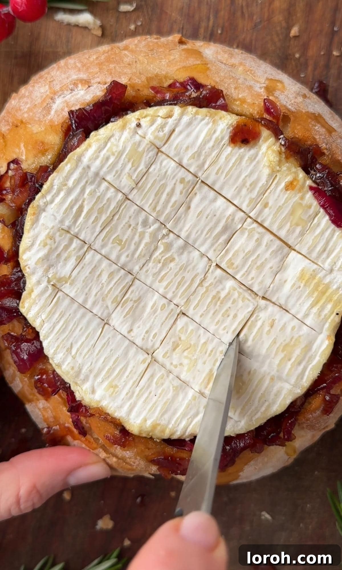 Golden Baked Camembert 8 Scoring the Camembert in a cross-hatch pattern and drizzling with honey and thyme.