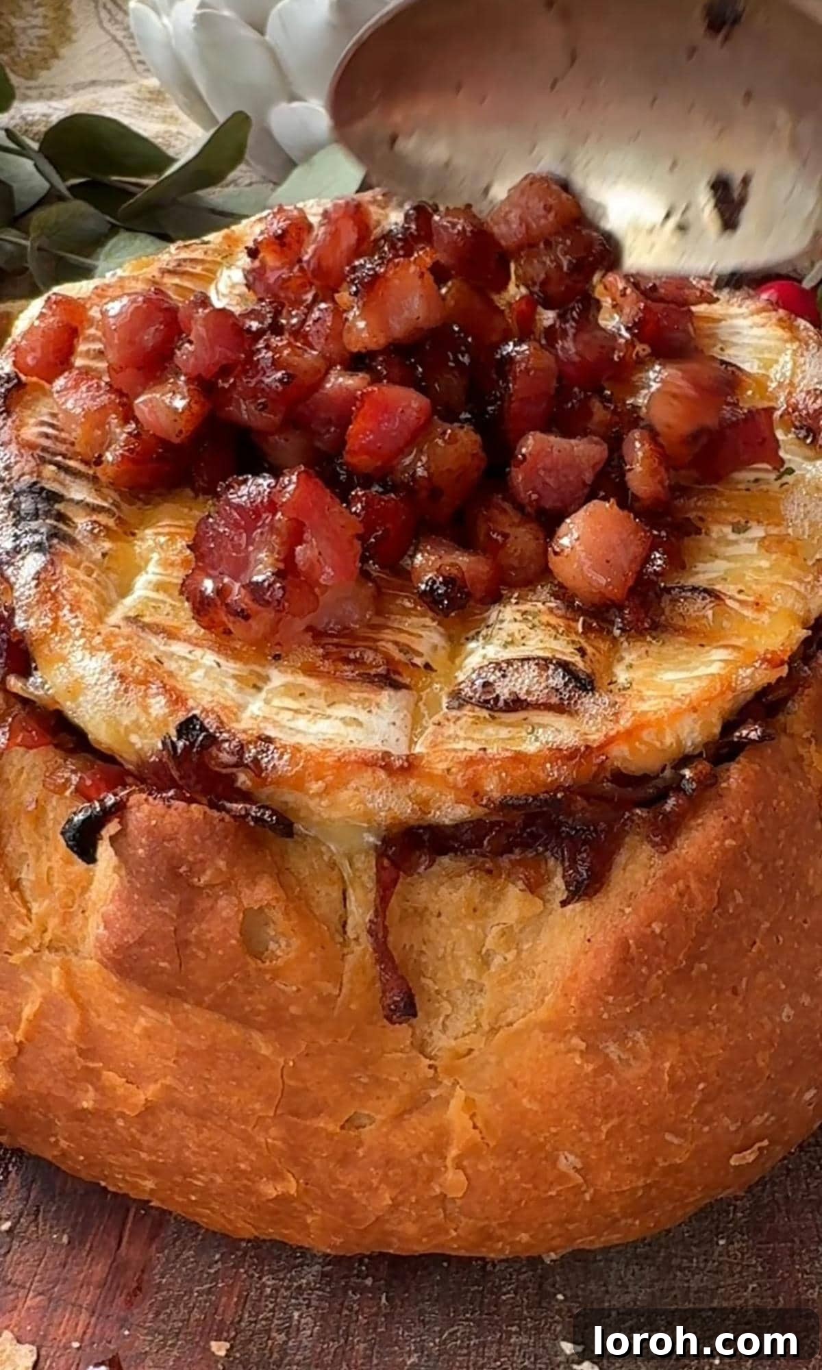 Golden Baked Camembert 9 Topping the baked Camembert Rôti with crispy pancetta cubes.