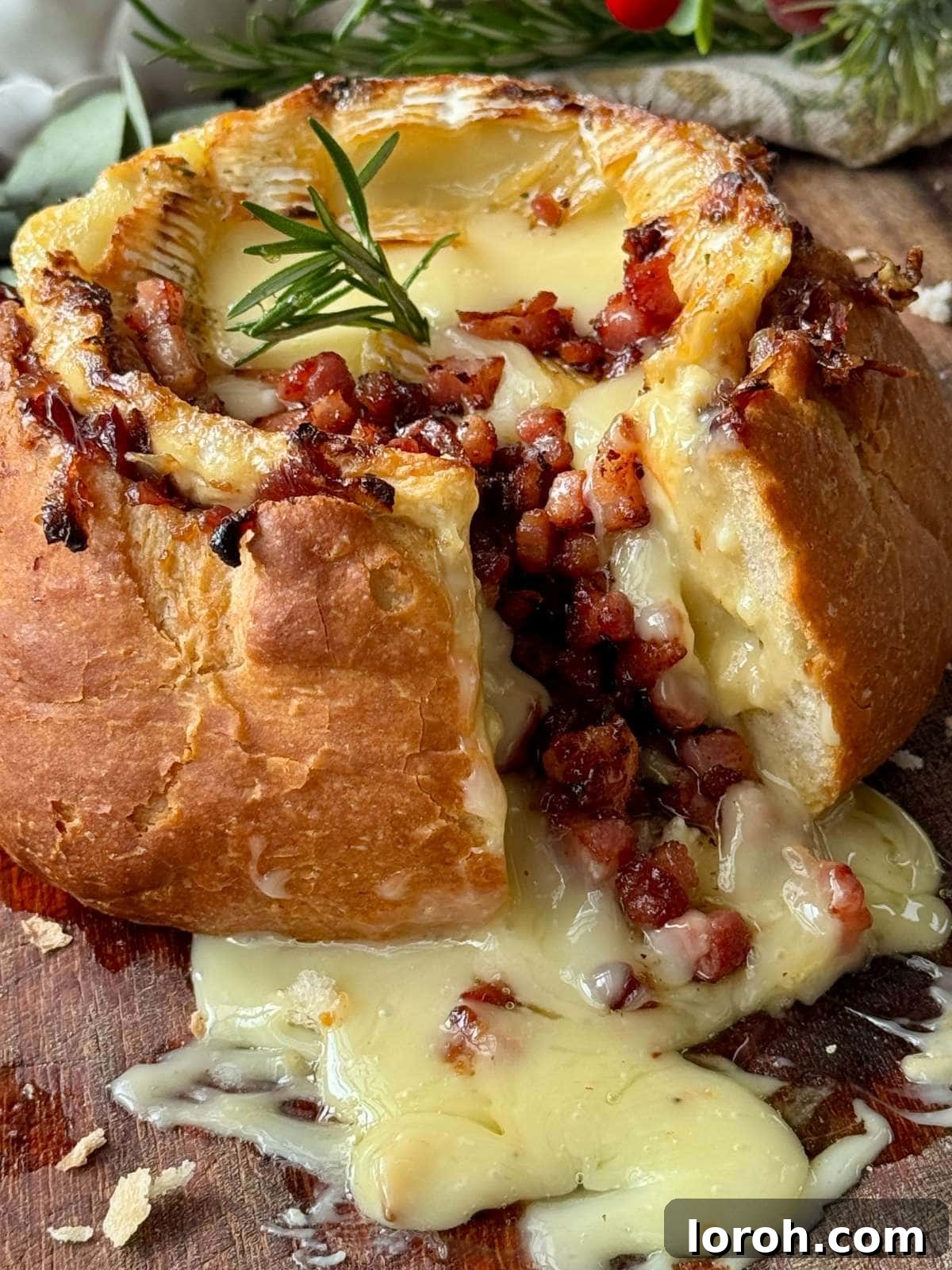 Golden Baked Camembert 10 Delicious baked camembert roti in a bread bowl, ready to be enjoyed.