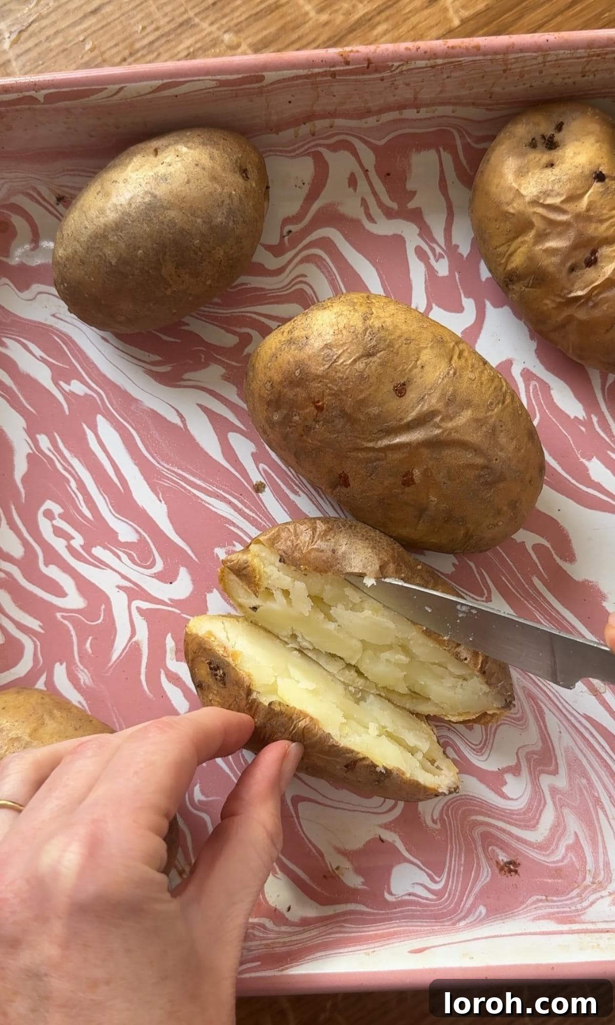 Decadent Twice Baked Mashed Potatoes 6 slicing baked potatoes in half.