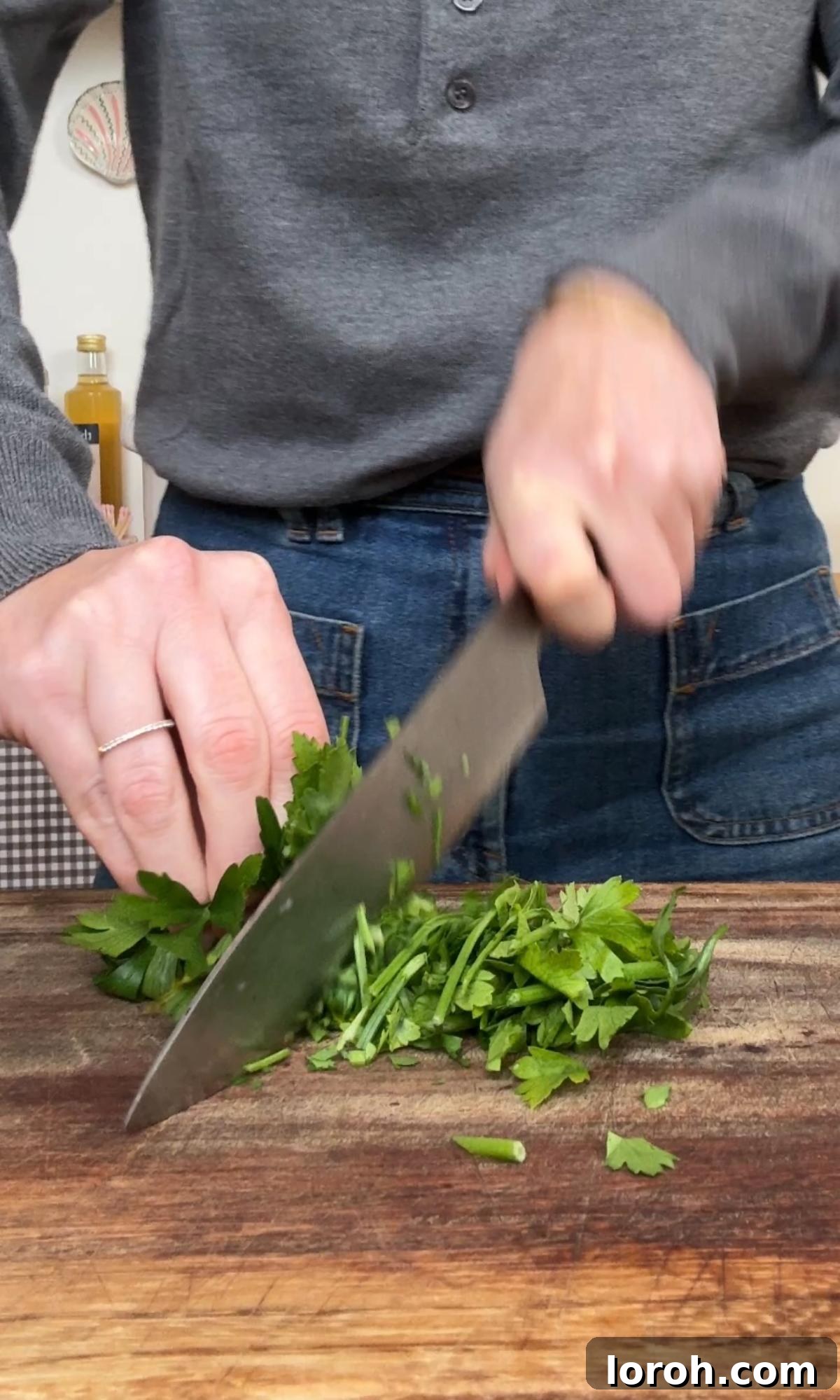 Effortless Homemade Cafe de Paris Butter 4 Finely chopping fresh parsley, a key ingredient for Cafe de Paris butter.
