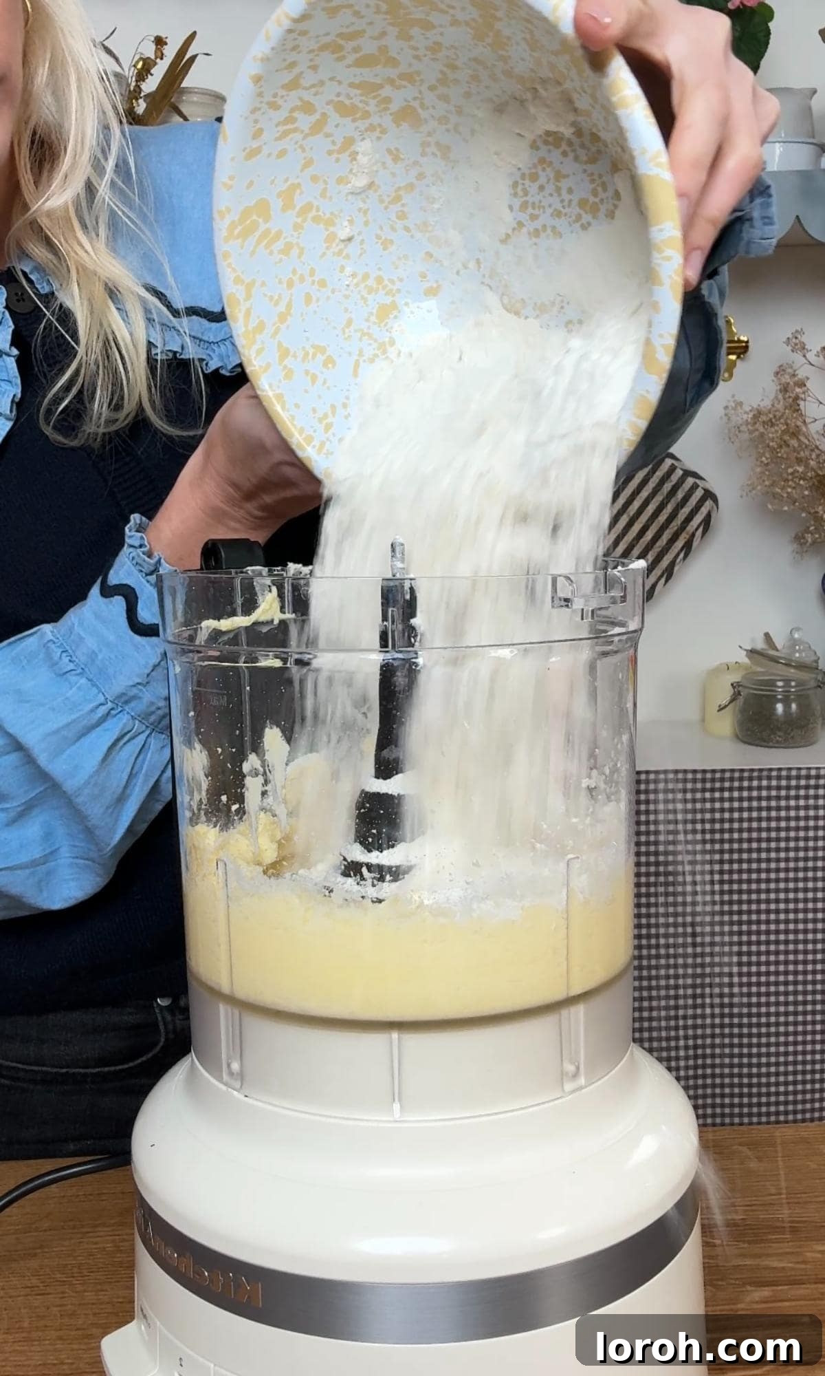 making the christmas tree cookie dough in a food processor, butter and sugar combined.