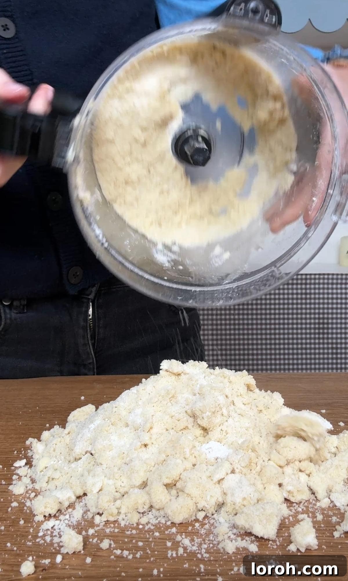 adding flour to the shortbread cookie dough in the food processor.