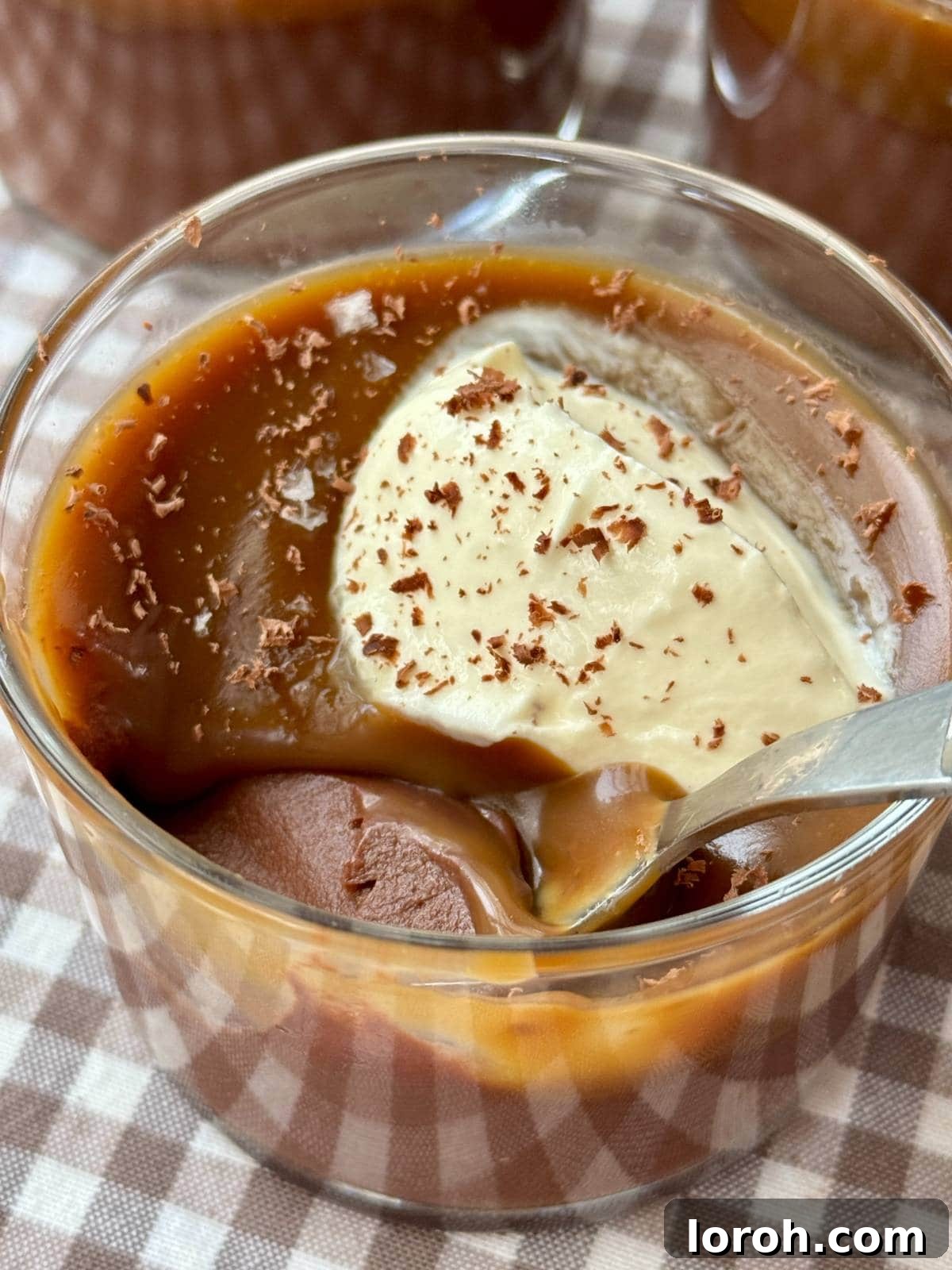 Velvet Chocolate Budino 2 Rich chocolate budino in a glass, elegantly topped with a swirl of creme fraiche and a sprinkle of sea salt.