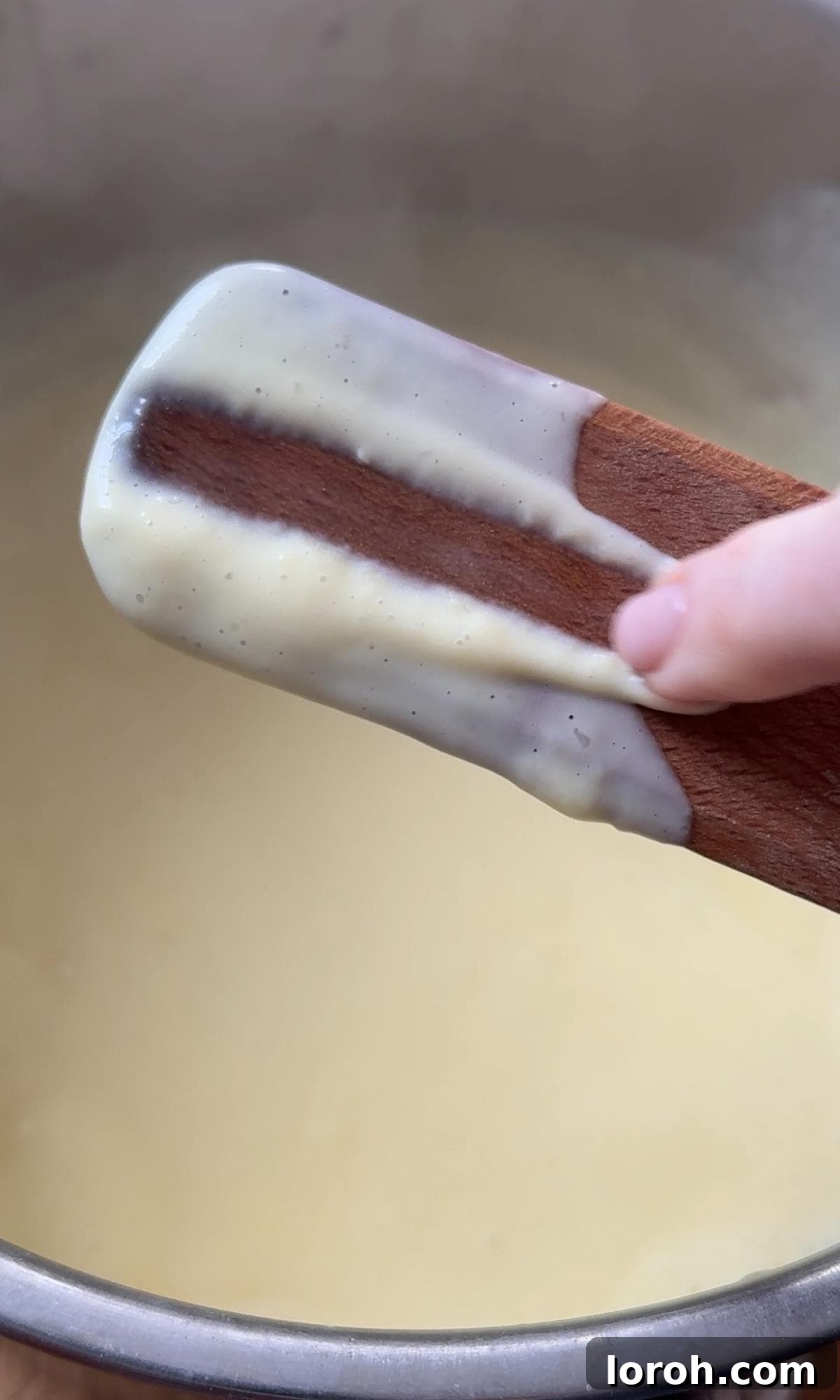 Velvet Chocolate Budino 6 Testing the custard's thickness by running a finger across the back of a spoon, leaving a clean line.