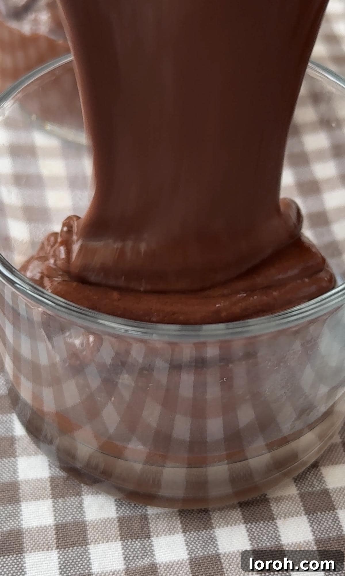 Velvet Chocolate Budino 9 Filling individual ramekins with the smooth chocolate budino mixture and topping with salted caramel sauce.