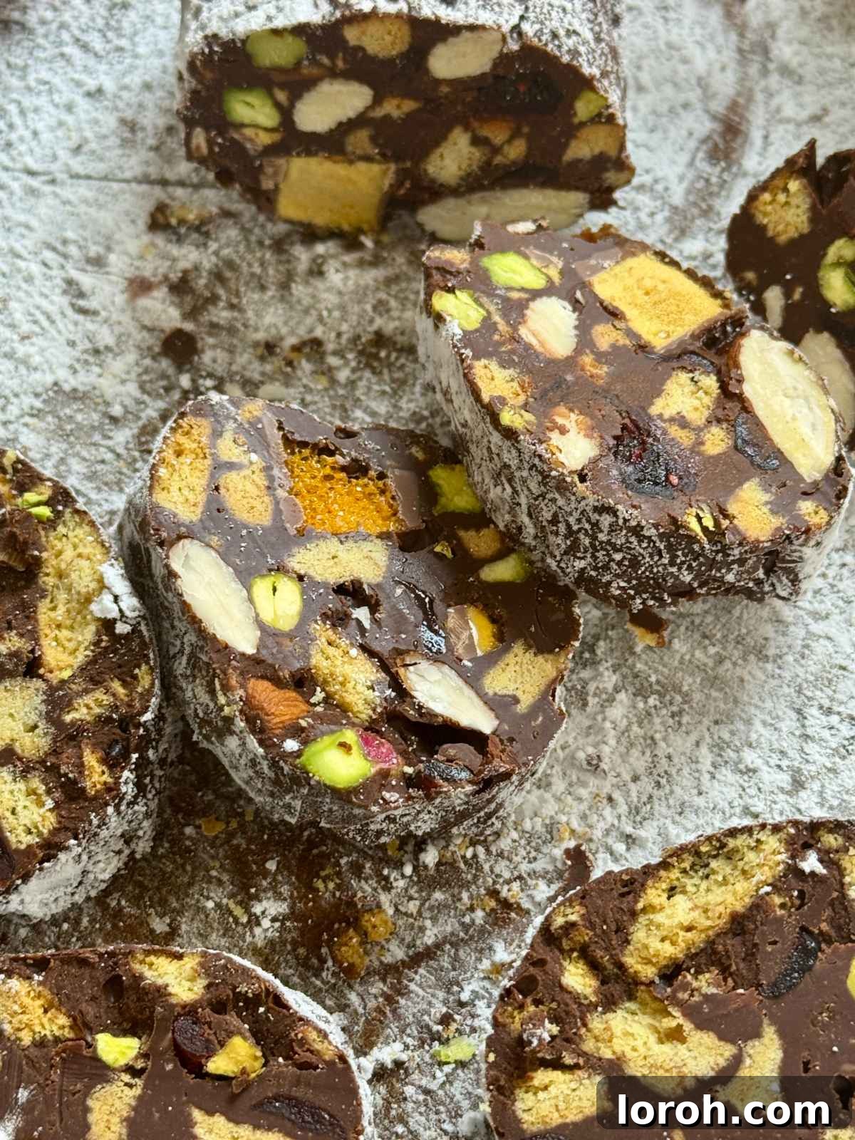 Decadent Chocolate Salami 2 chocolate salami sliced, showcasing the biscuit and nut 'fat' speckles.