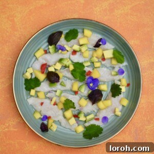 Freshly prepared Ceviche inspired by Martha Ortiz, beautifully plated with vibrant garnishes.