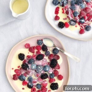Frozen Berries with Hot White Chocolate Sauce, beautifully presented in a bowl.