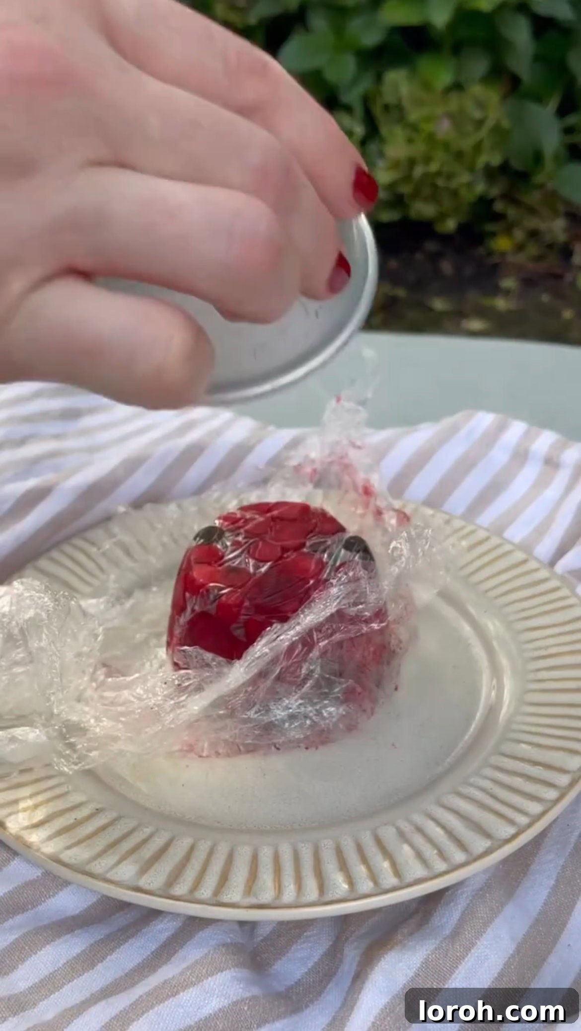 Warm White Chocolate Berry Indulgence 5 Turning out the perfectly frozen berry mold onto a serving plate.