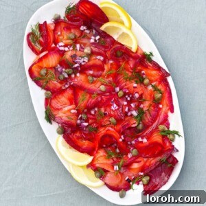 Vibrant Beetroot Cured Salmon Gravadlax, thinly sliced and ready to serve