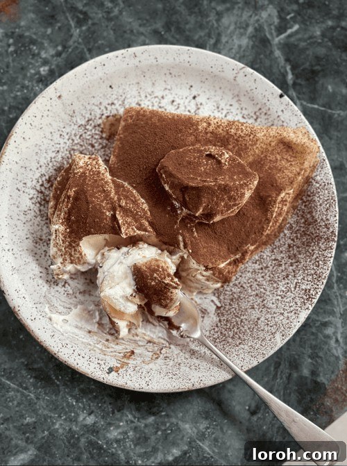 tiramisu pancakes on a plate, elegantly stacked.