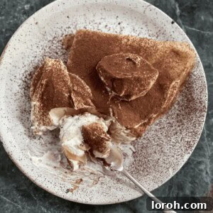 tiramisu pancakes on a plate, garnished with cocoa.
