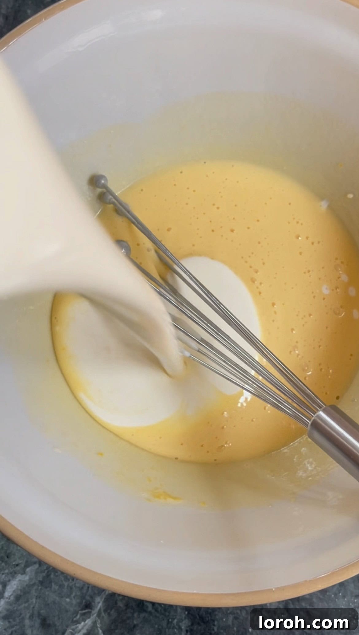 adding double cream and Baileys to the mascarpone mixture.